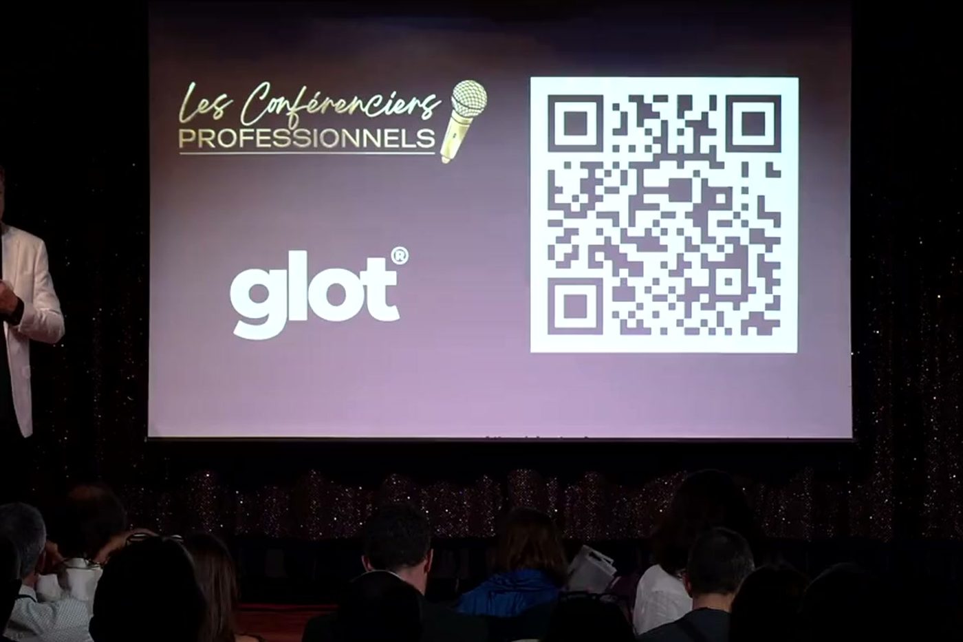 Glot QR code projected on a big screen before a talk