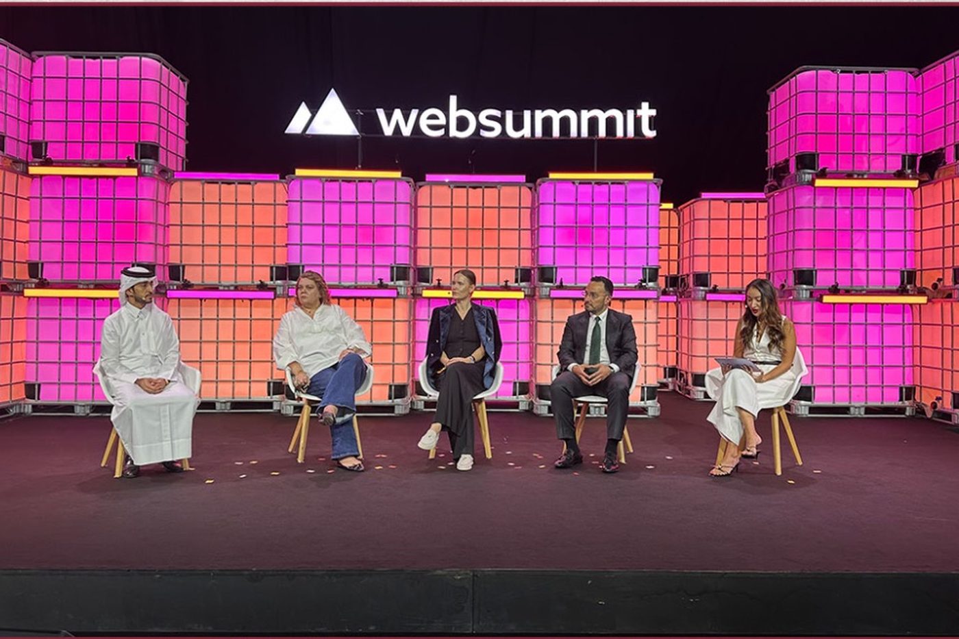 Five panelists seated on the Web Summit Qatar stage